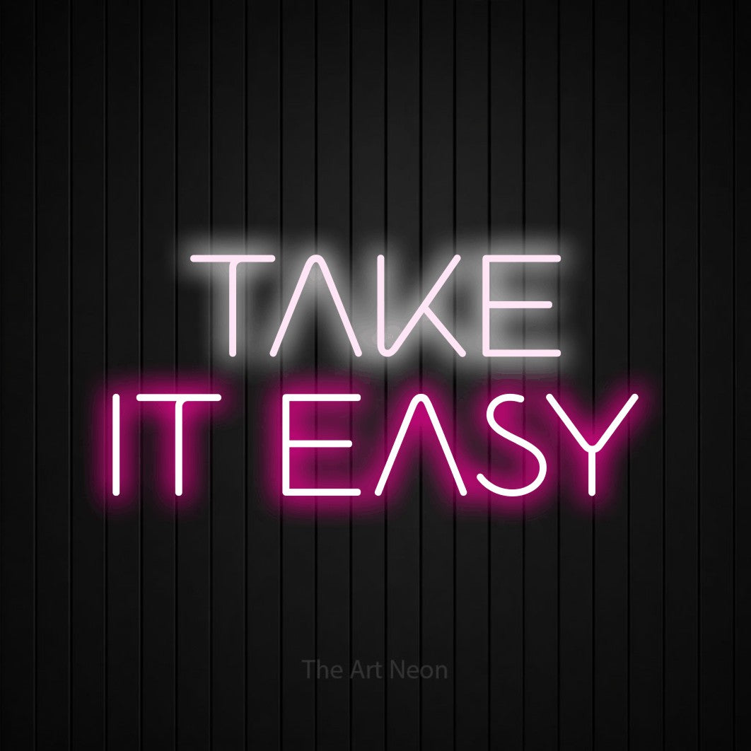 Hot pink and cool white LED neon sign reading "Take It Easy" against a black vertical slat wall for living room décor