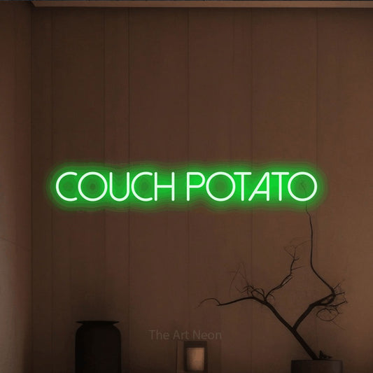Green LED neon sign reading "Couch Potato" against a warm brown wall for living room décor