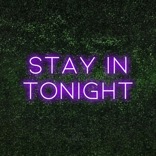 Purple LED neon sign reading "Stay In Tonight" against a textured green moss wall for living room décor