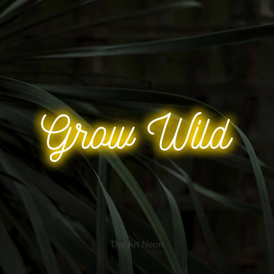Yellow script-style LED neon sign reading "Grow Wild" against dark tropical leaves for living room décor