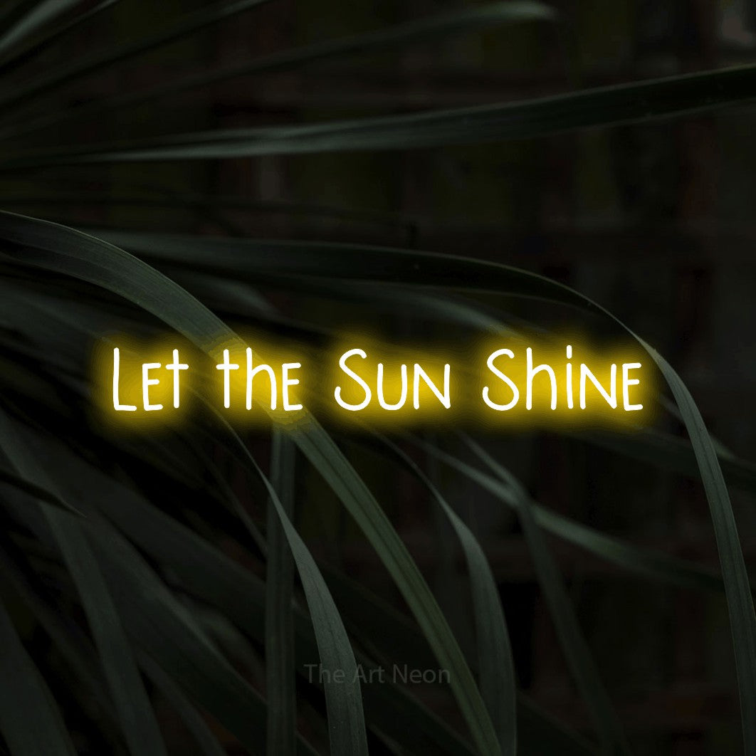 Yellow LED neon sign reading "Let the Sun Shine" against dark tropical leaves for living room décor
