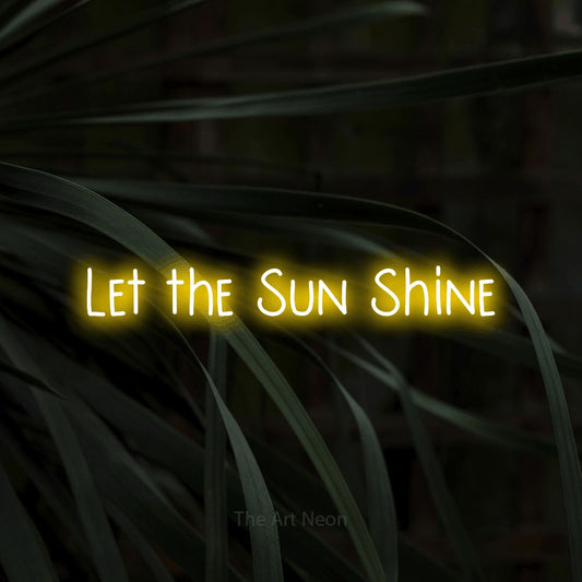 Yellow LED neon sign reading "Let the Sun Shine" against dark tropical leaves for living room décor