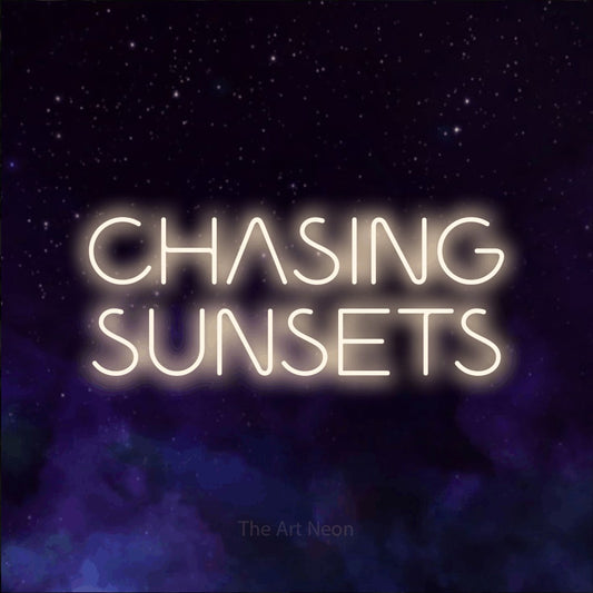 Warm white LED neon sign reading "Chasing Sunsets" against a purple galaxy background for living room décor