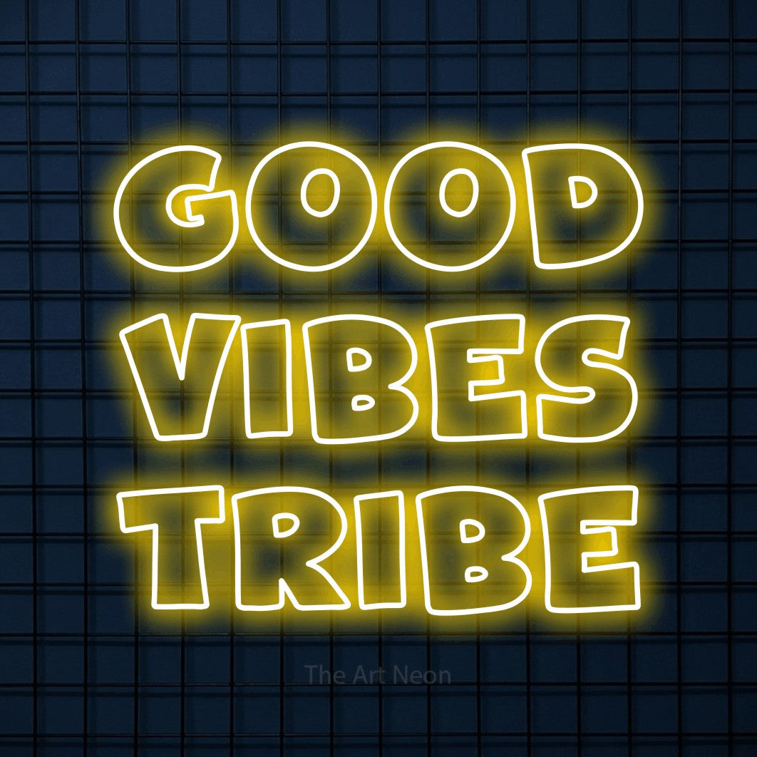 Yellow outline-style LED neon sign reading "Good Vibes Tribe" against a dark blue tiled wall for living room décor