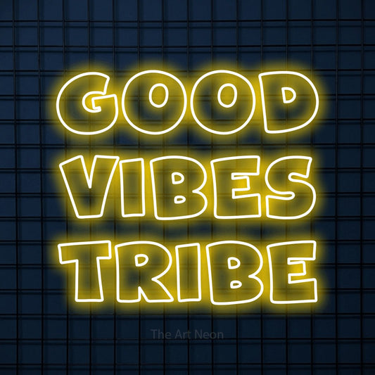 Yellow outline-style LED neon sign reading "Good Vibes Tribe" against a dark blue tiled wall for living room décor