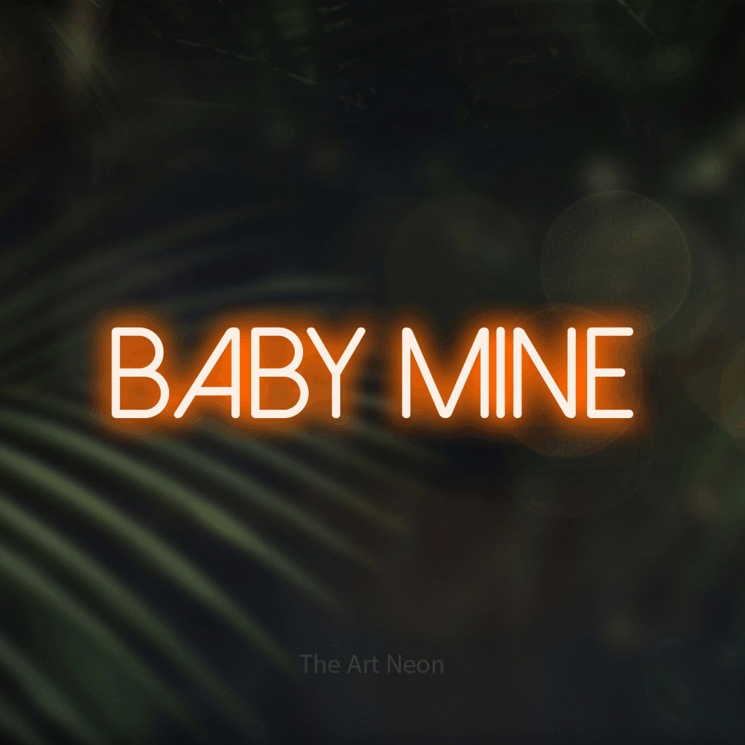 Enseigne néon à DEL à lumière orange, affichant « Baby Mine » sur des feuilles de palmier foncées et floues, pour décorer une chambre de bébé