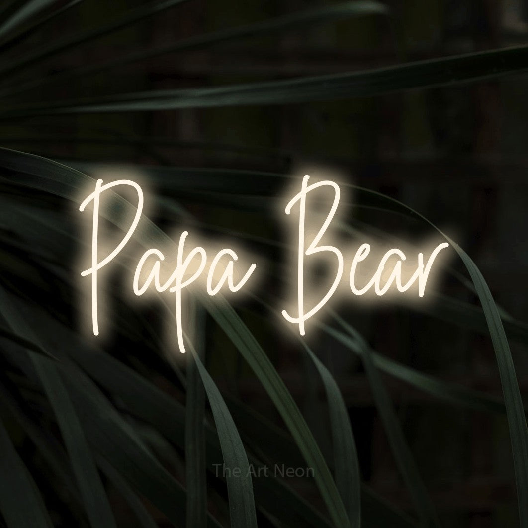 Enseigne néon à DEL à lumière blanche chaude, de style manuscrit, affichant « Papa Bear » sur des feuilles tropicales foncées, pour décorer une chambre de bébé