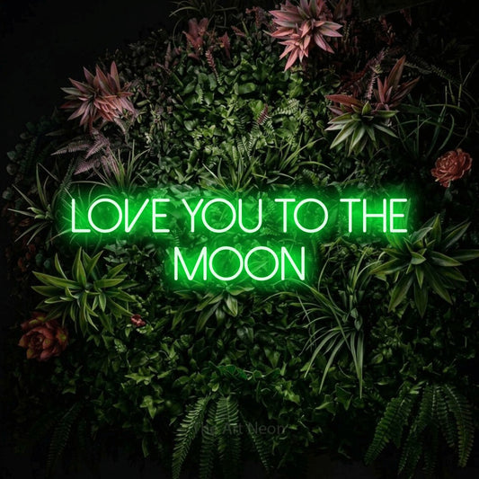 Green LED neon sign reading "Love You to the Moon" against a flowering garden wall for nursery décor