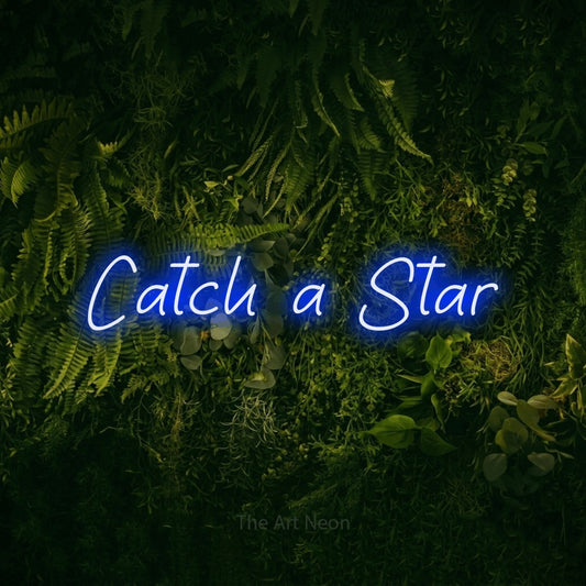 Blue LED neon sign reading "Catch a Star" against a moss-covered green wall for nursery décor