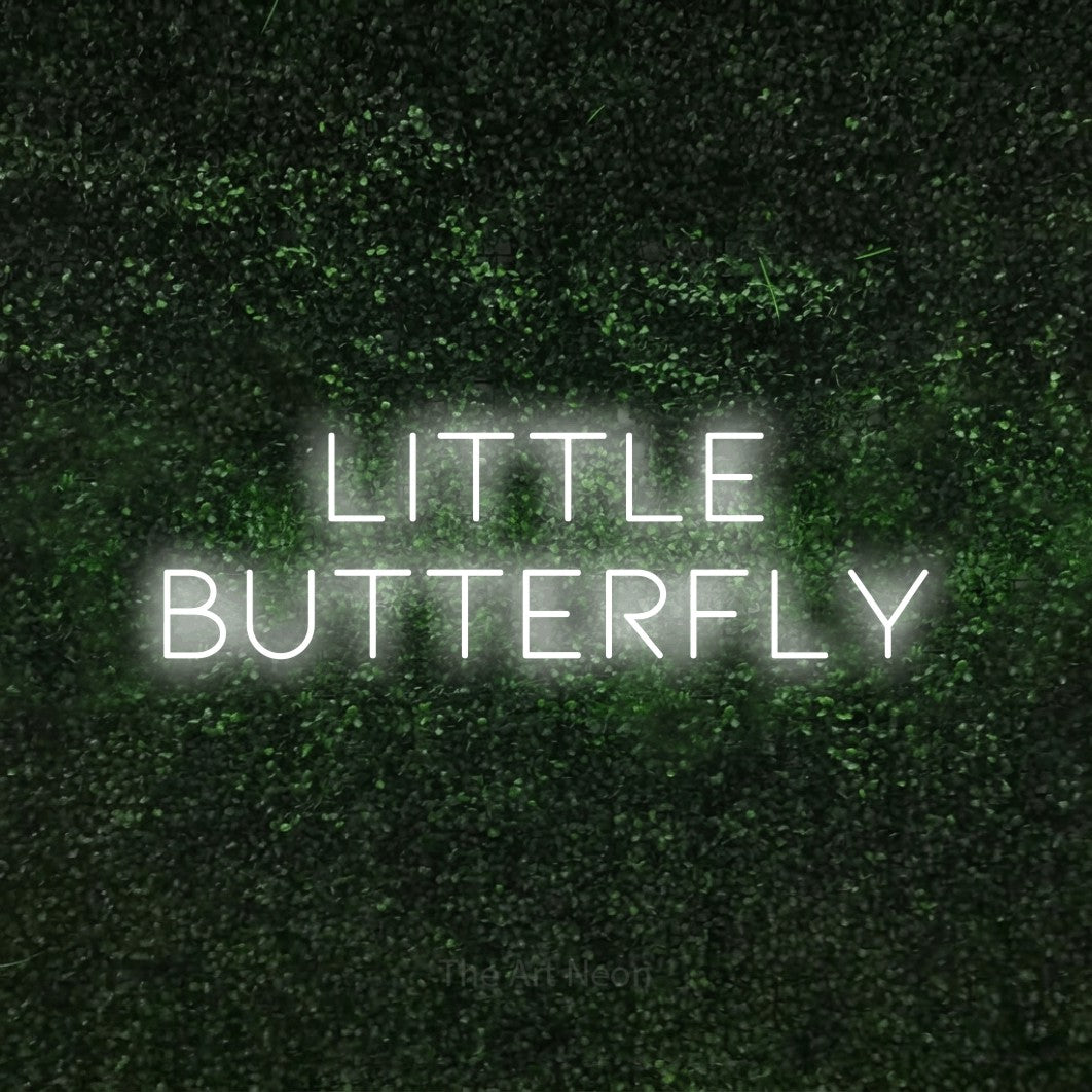 Cool white LED neon sign reading "Little Butterfly" against a textured green moss wall for nursery décor