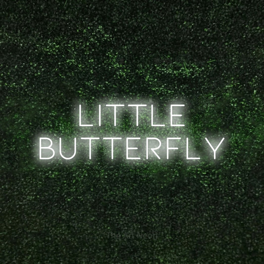 Cool white LED neon sign reading "Little Butterfly" against a textured green moss wall for nursery décor