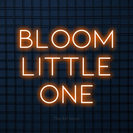 Orange LED neon sign reading "Bloom Little One" against a dark blue tiled wall for nursery décor