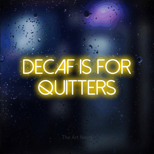 Yellow LED neon sign reading "Decaf is for Quitters" against a dark blue bokeh background for kitchen décor