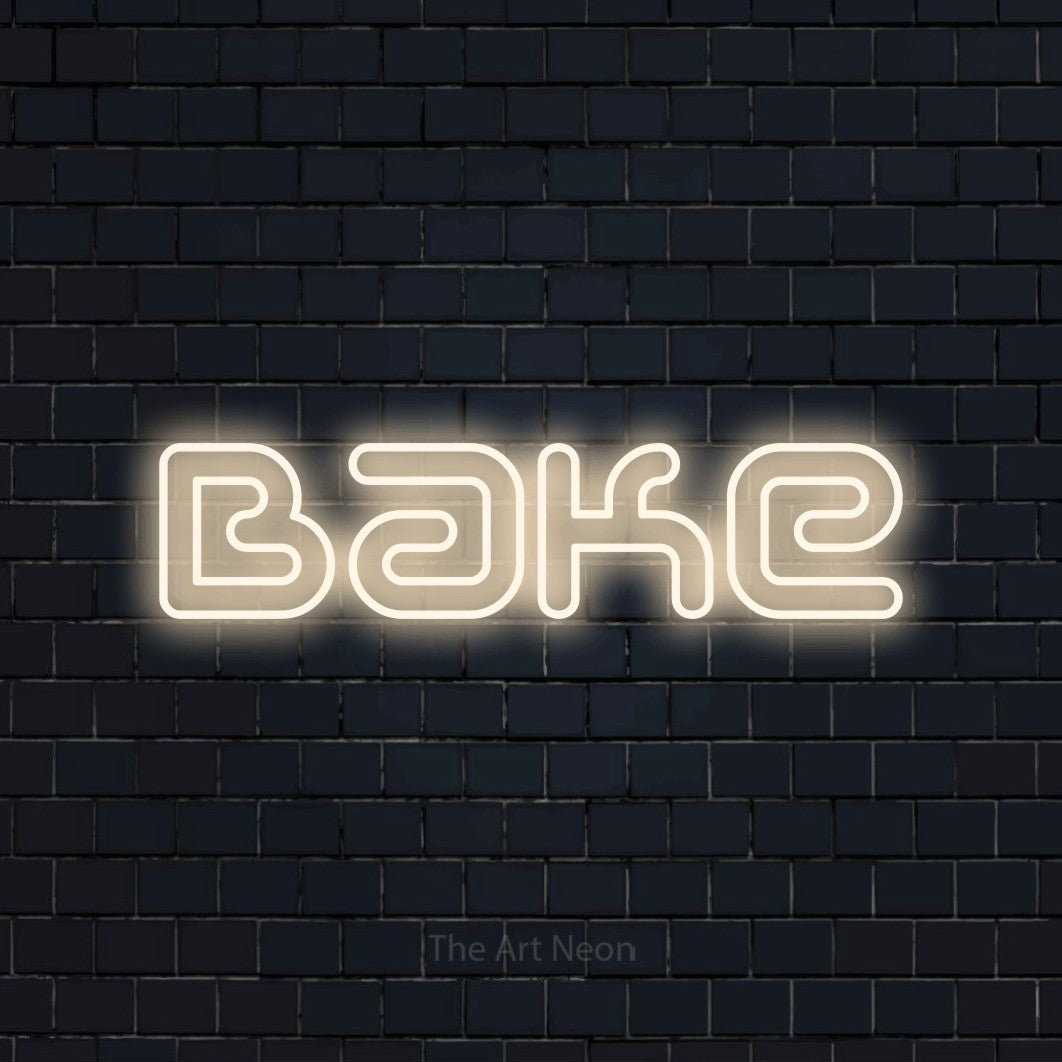 Warm white outline-style LED neon sign reading "Bake" against a dark navy brick wall for kitchen décor