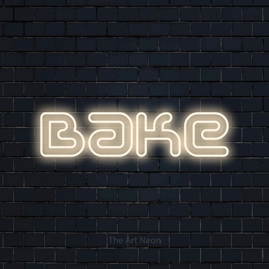 Warm white outline-style LED neon sign reading "Bake" against a dark navy brick wall for kitchen décor