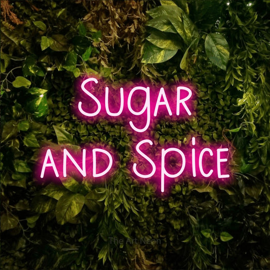 Hot pink LED neon sign reading "Sugar and Spice" against a textured moss and foliage wall for kitchen décor