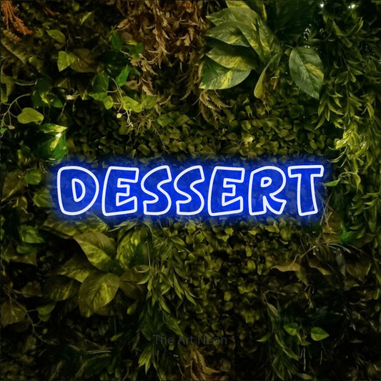 Blue outline-style LED neon sign reading "Dessert" against a textured moss and foliage wall for kitchen décor