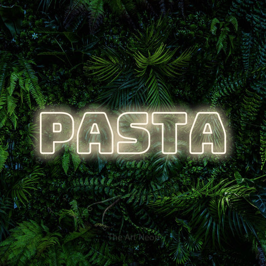 Warm white outline-style LED neon sign reading "Pasta" against a dense tropical foliage wall for kitchen décor