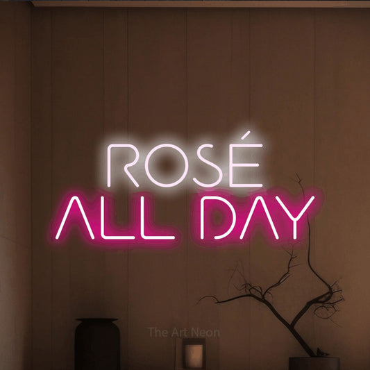 Hot pink and cool white LED neon sign reading "Rosé All Day" against a warm brown wall for kitchen décor