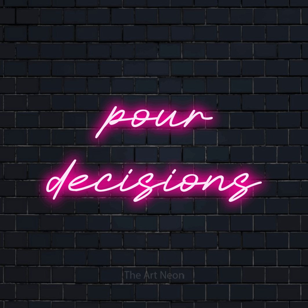 Hot pink LED neon sign reading "Pour Decisions" against a dark navy brick wall for kitchen décor