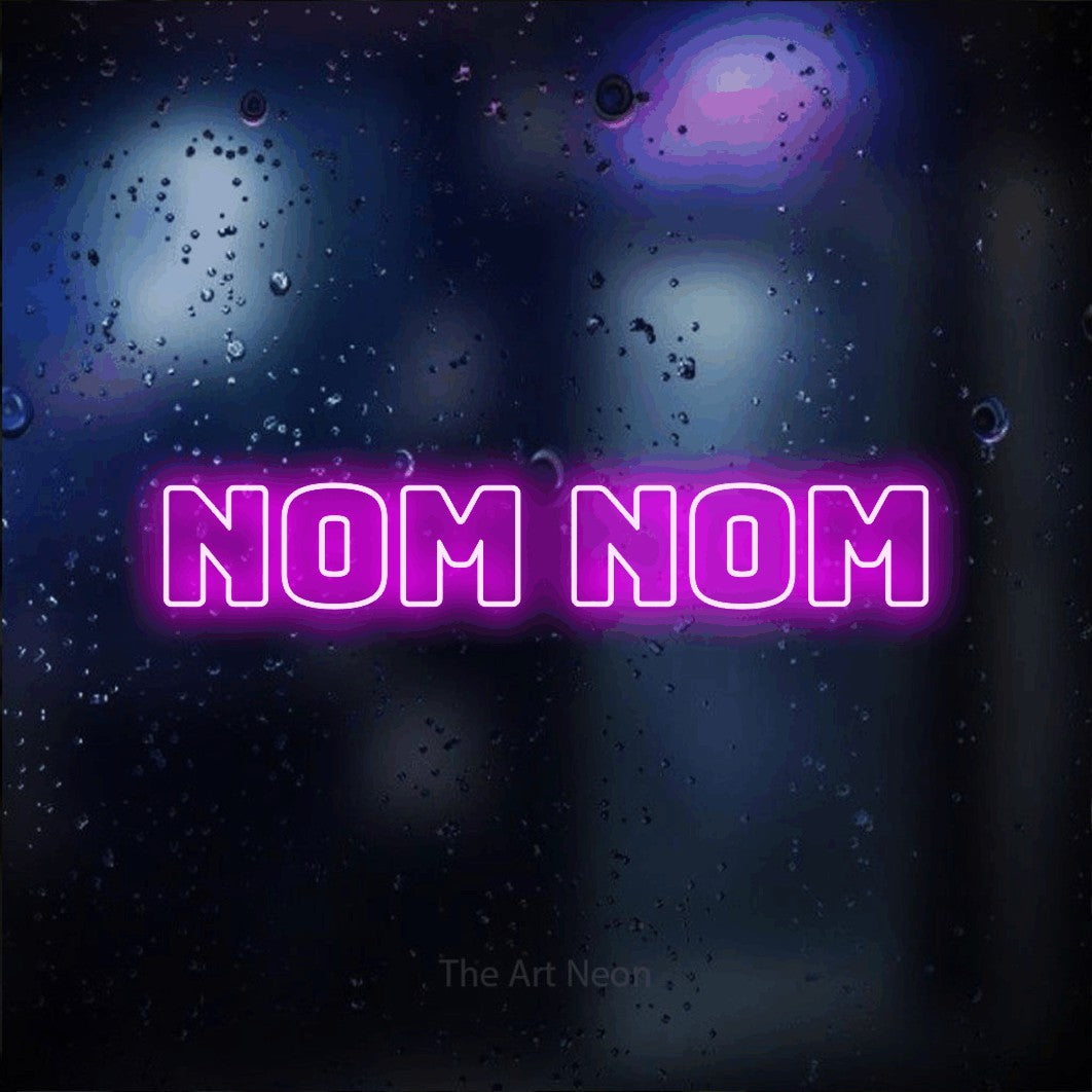 Pink outline-style LED neon sign reading "Nom Nom" against a dark blue bokeh background for kitchen décor