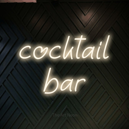 Warm white LED neon sign reading "Cocktail Bar" against a dark geometric wood wall for bar décor