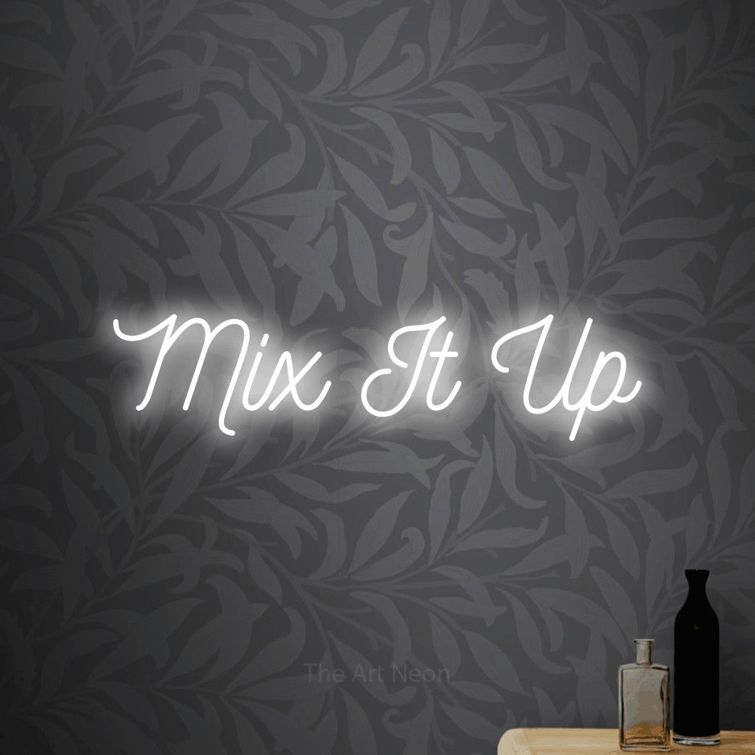 Cool white script-style LED neon sign reading "Mix It Up" against light grey floral wallpaper for bar décor