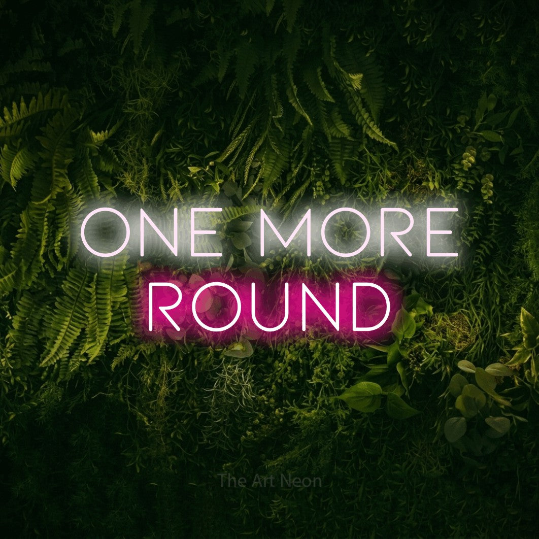 Hot pink and cool white LED neon sign reading "One More Round" against a moss-covered green wall for bar décor