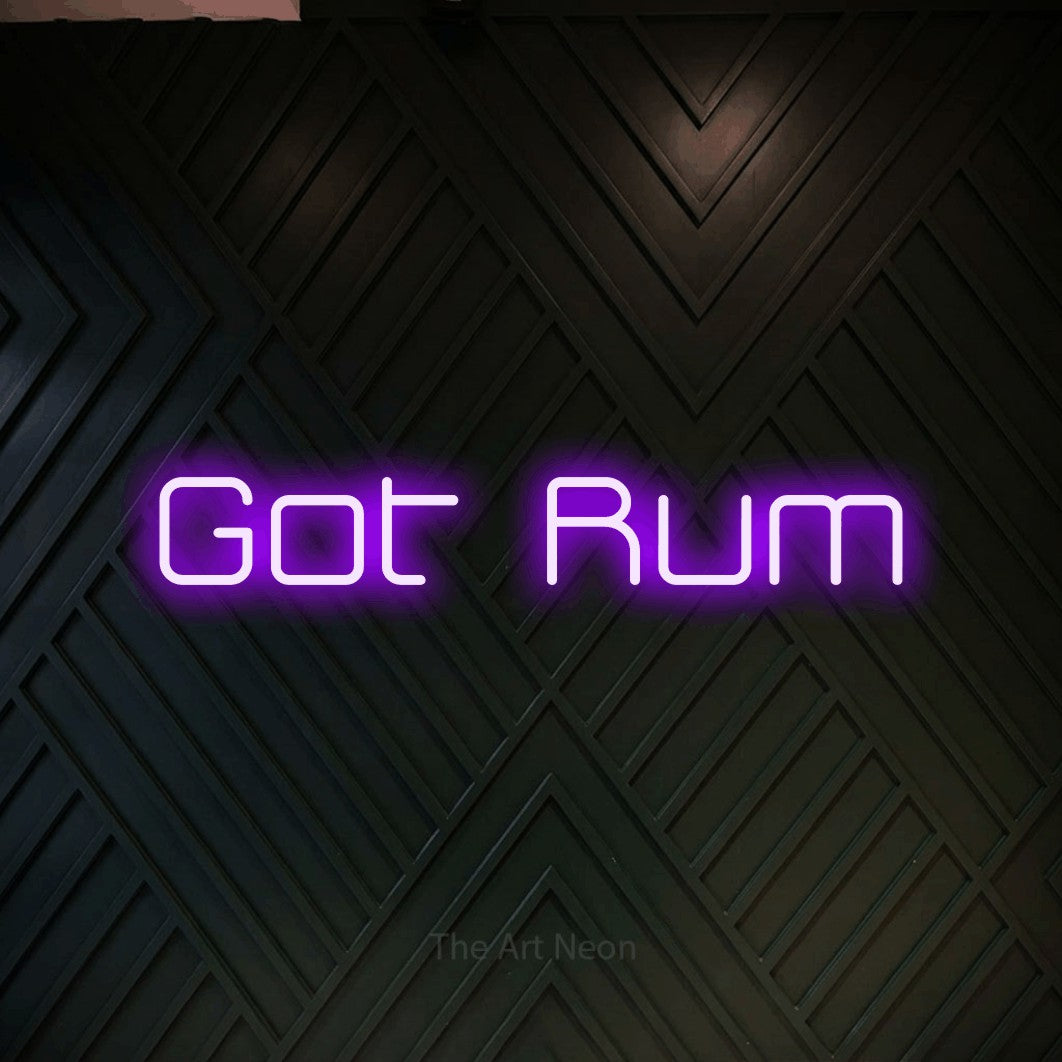 Purple LED neon sign reading "Got Rum" against a dark geometric wood wall for bar décor