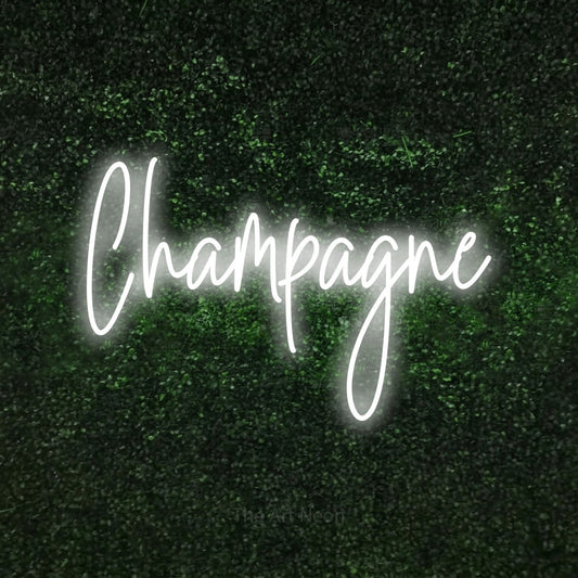 Cool white script-style LED neon sign reading "Champagne" against a textured green moss wall for bar décor