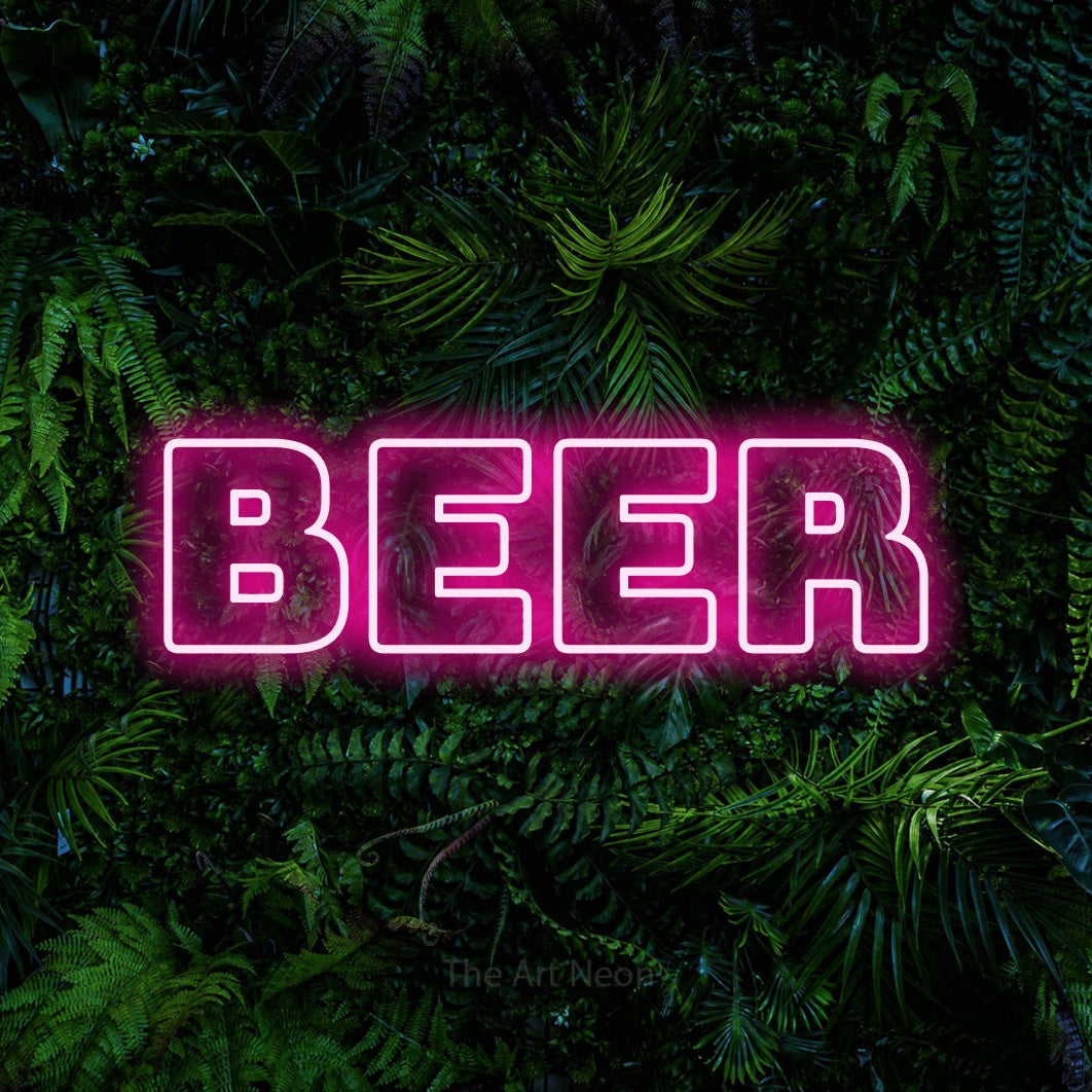 Hot pink outline-style LED neon sign reading "Beer" against a dense tropical foliage wall for bar décor