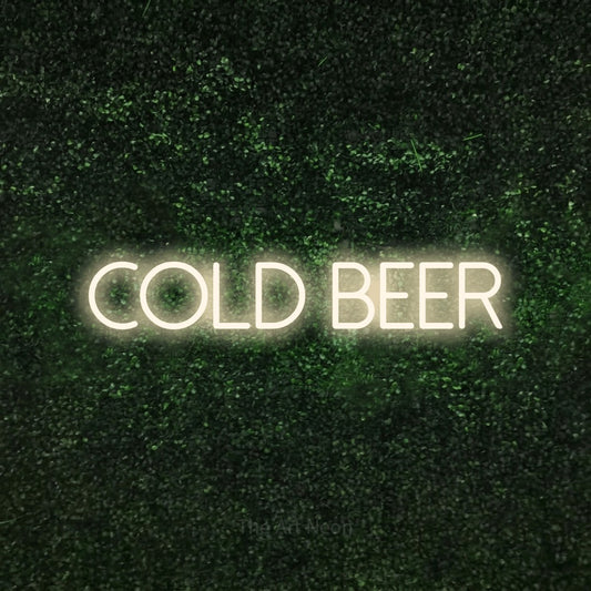 Warm white LED neon sign reading "Cold Beer" against a textured green moss wall for bar décor