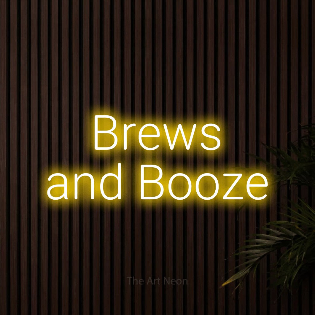 Yellow LED neon sign reading "Brews and Booze" against dark wooden slats for bar décor