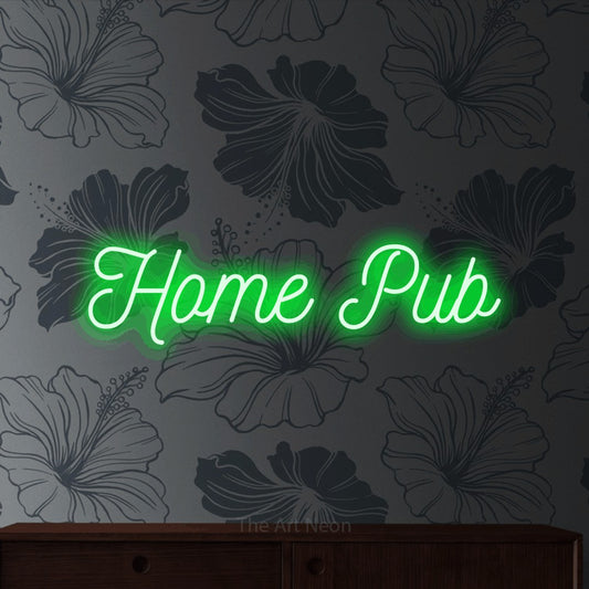 Green script-style LED neon sign reading "Home Pub" against grey floral wallpaper for bar décor