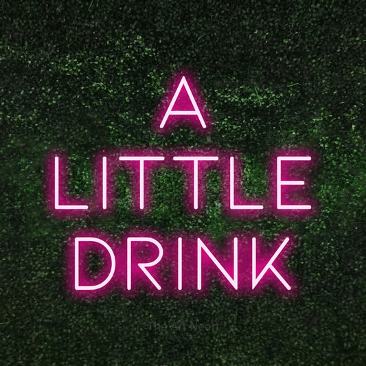 Hot pink LED neon sign reading "A Little Drink" against a textured green moss wall for bar décor