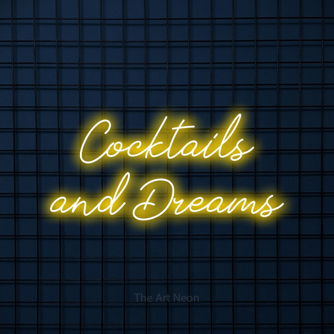 Yellow script-style LED neon sign reading "Cocktails and Dreams" against a dark blue tiled wall for bar décor