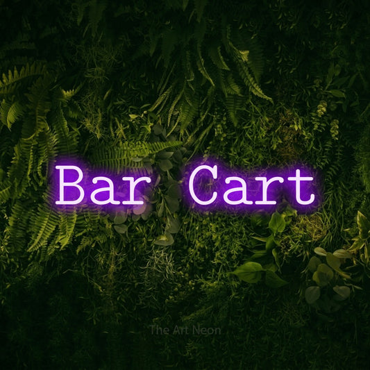Purple LED neon sign reading "Bar Cart" against a moss-covered green wall for bar décor