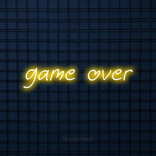 Yellow LED neon sign reading "Game Over" against a dark blue tiled wall for gaming room décor