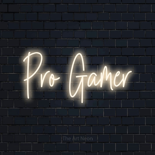 Warm white script-style LED neon sign reading "Pro Gamer" against a dark navy brick wall for gaming room décor