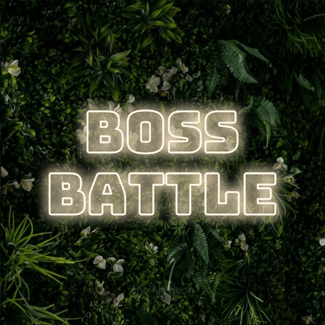 Warm white outline-style LED neon sign reading "Boss Battle" against a leafy green wall for gaming room décor