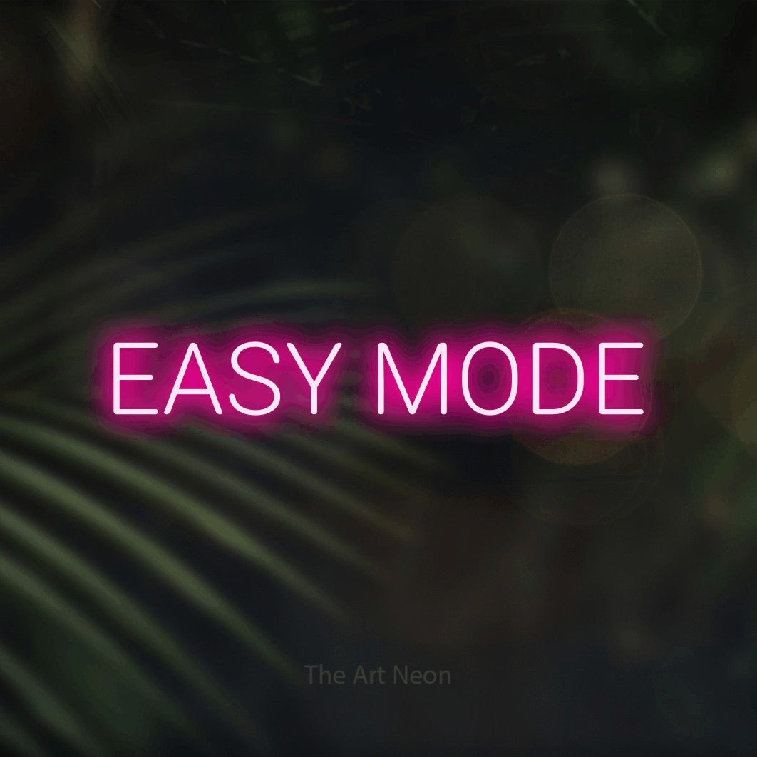 Enseigne néon à DEL à lumière rose vif, affichant « Easy Mode » sur des feuilles de palmier foncées et floues, pour décorer une salle de jeu