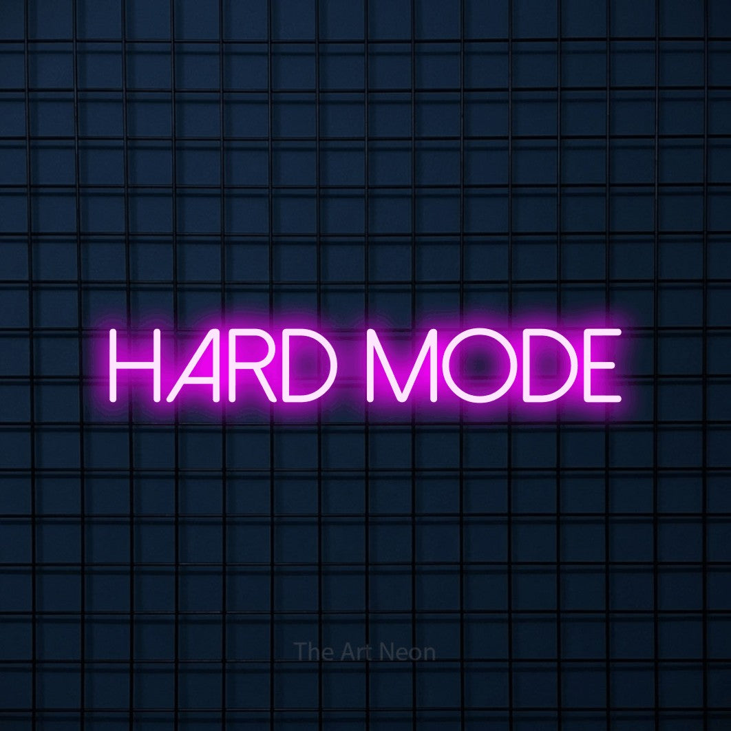 Pink LED neon sign reading "Hard Mode" against a dark blue tiled wall for gaming room décor