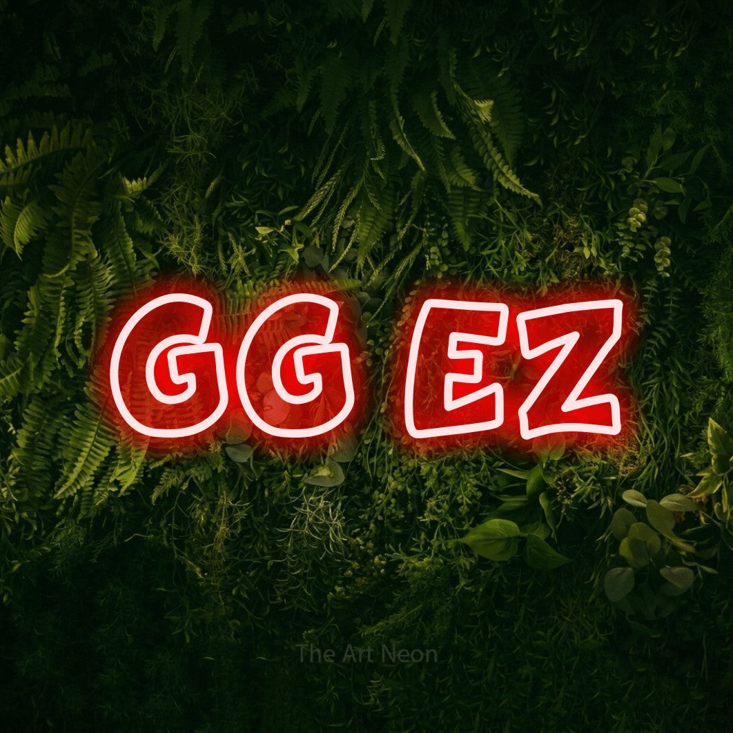 Red outline-style LED neon sign reading "GG EZ" against a moss-covered green wall for gaming room décor