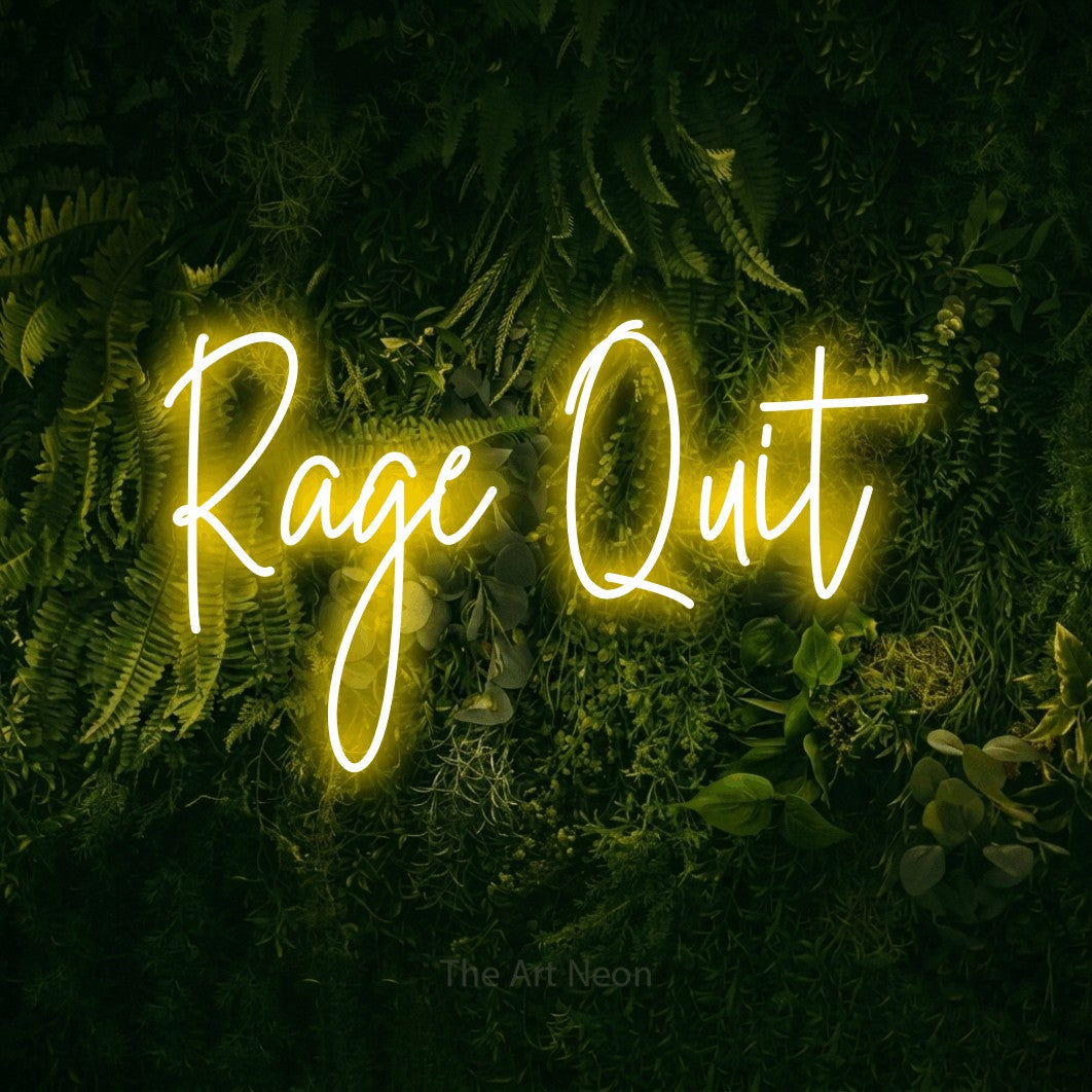 Yellow script-style LED neon sign reading "Rage Quit" against a moss-covered green wall for gaming room décor