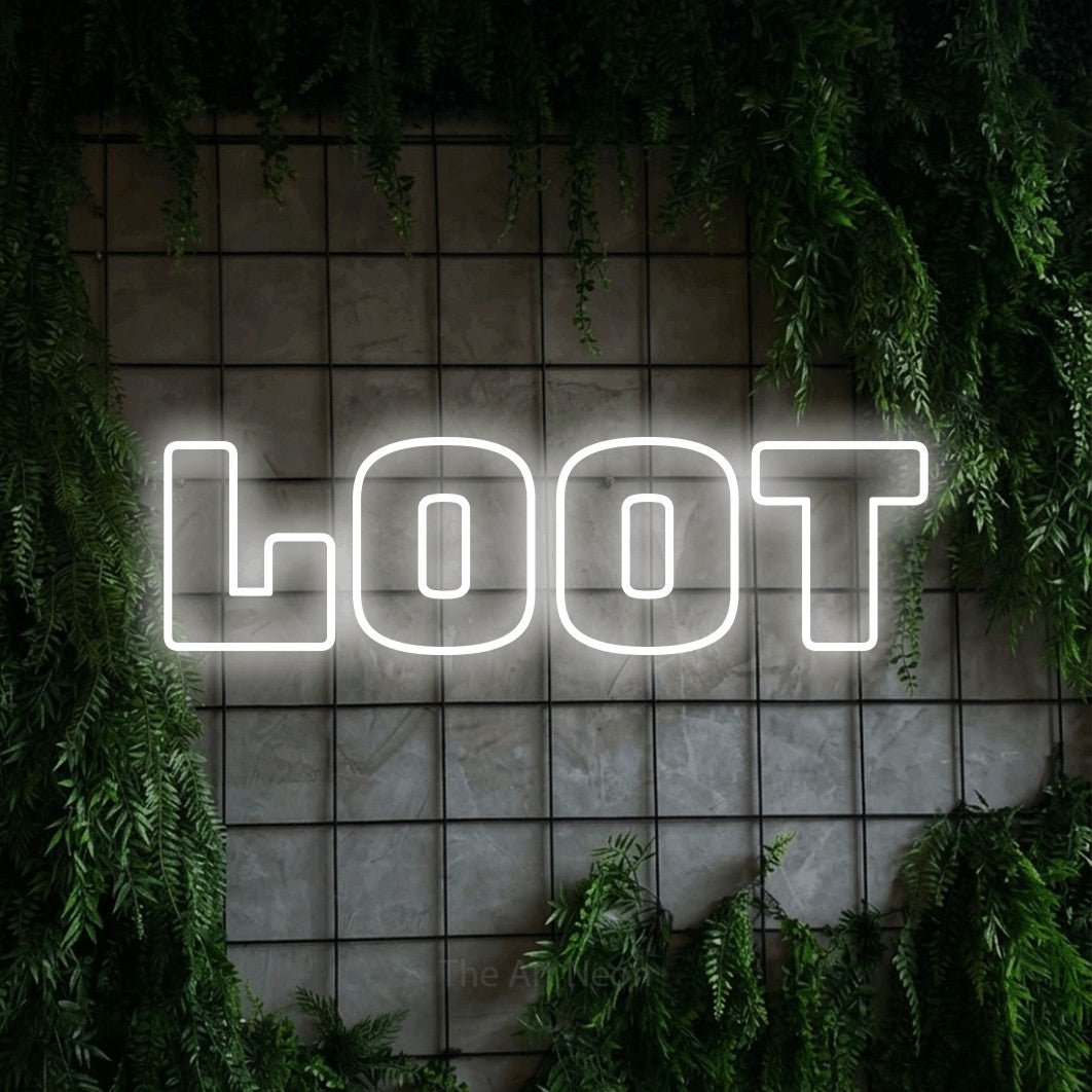 Cool white outline-style LED neon sign reading "Loot" against a green grid wall with foliage for gaming room décor