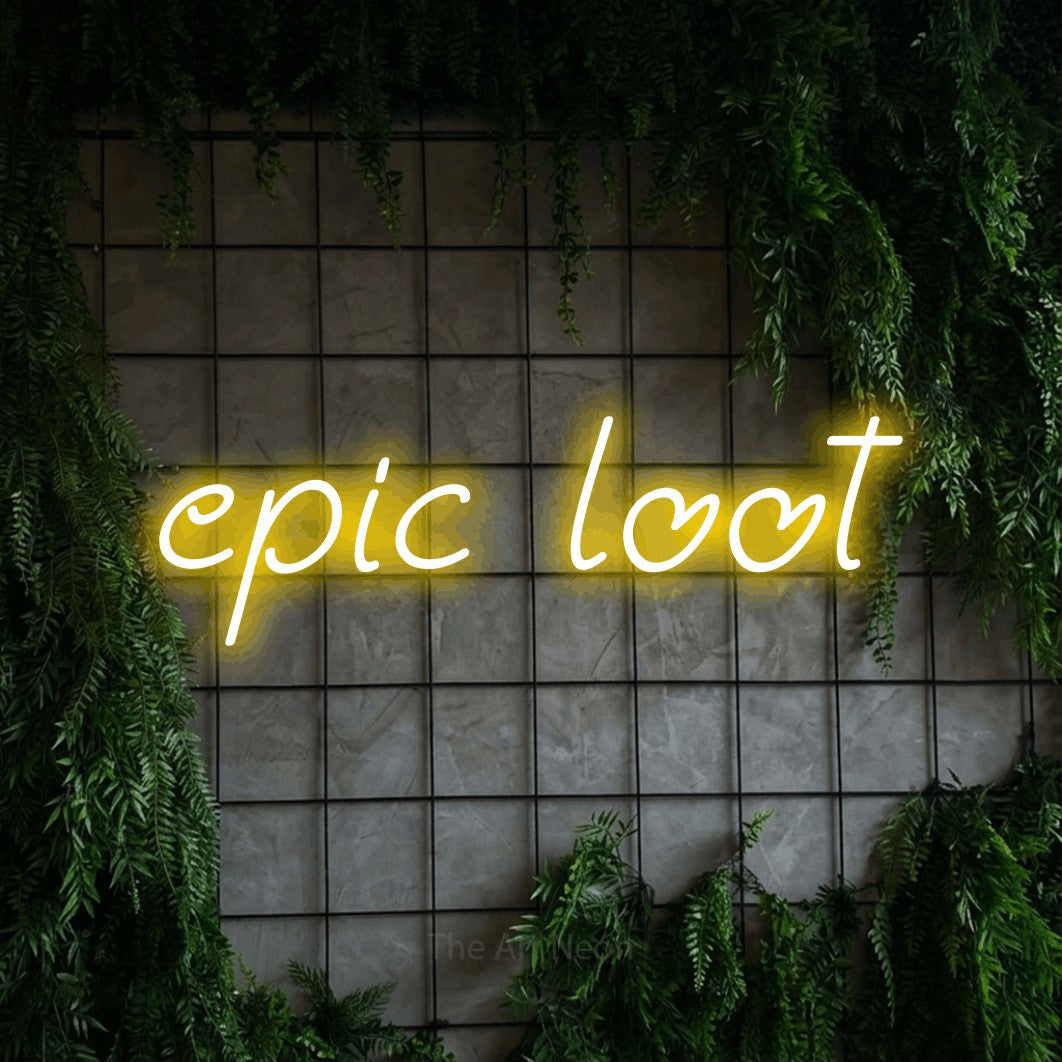 Enseigne néon à DEL à lumière jaune, affichant « Epic Loot » sur un mur quadrillé vert avec du feuillage, pour décorer une salle de jeu