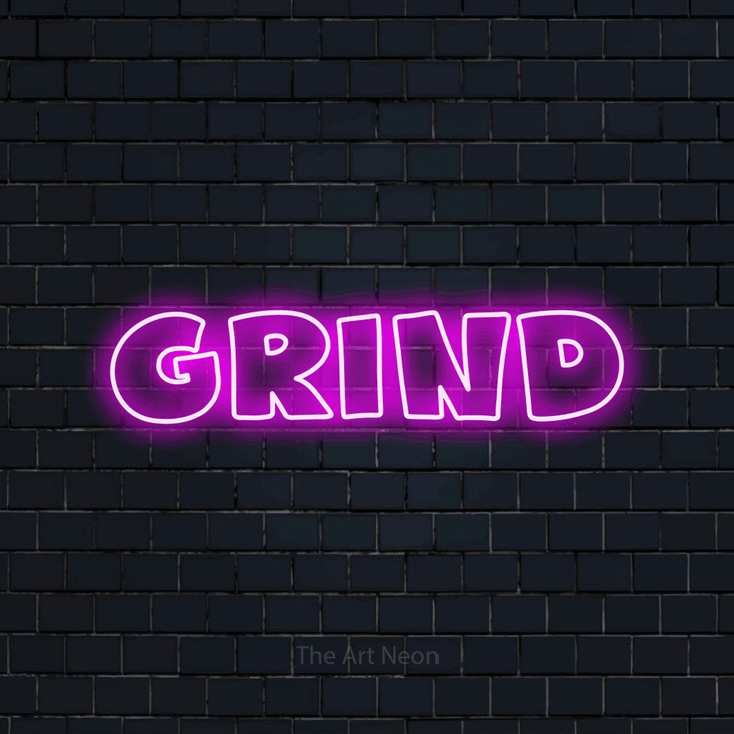 Enseigne néon à DEL à lumière rose, de style contour, affichant « Grind » sur un mur de briques bleu marine foncé, pour décorer une salle de jeu