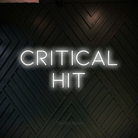 Cool white LED neon sign reading "Critical Hit" against a dark geometric wood wall for gaming room décor