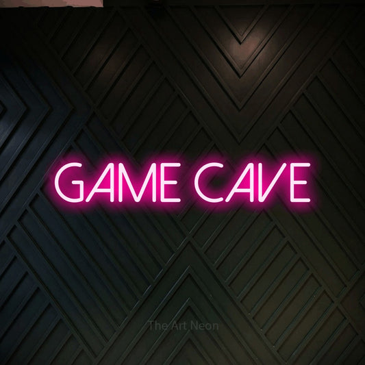 Hot pink LED neon sign reading "Game Cave" against a dark geometric wood wall for gaming room décor