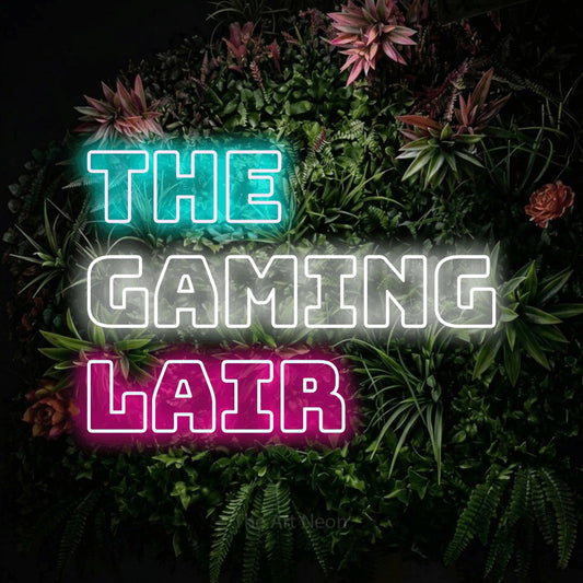 Multicolour outline-style LED neon sign reading "The Gaming Lair" against a flowering garden wall for gaming room décor